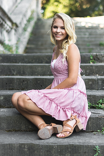 # Ulisse Albiati Photographer: fashionable model in a location shooting, sitting on the church steps. Cathedral of San Miniato al Monte in Florence, Tuscany.