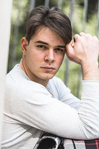 # Ulisse Albiati Photographer: handsome model in a location shooting, looking serious at the portfolio viewer. The specola of Villa Strozzi al Boschetto in Florence, Tuscany.