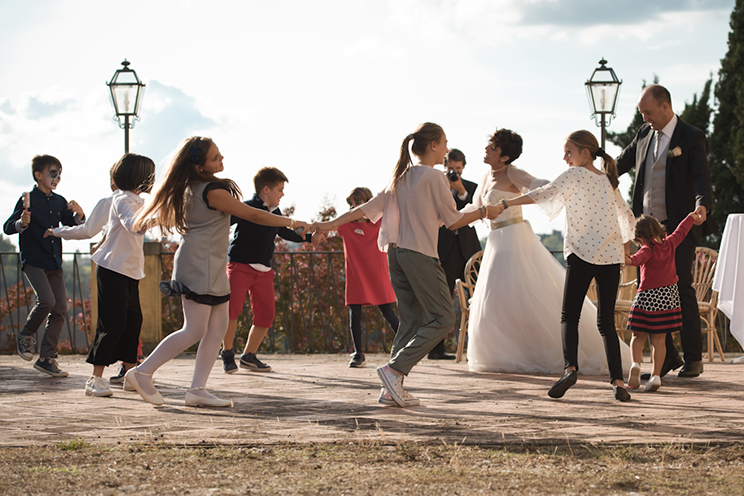 # Children and the married couple in a ring a ring o' roses.