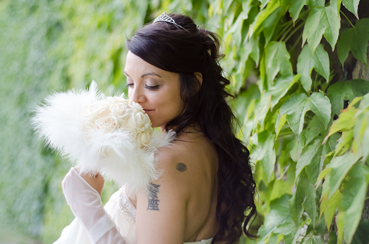 # A fashion style portrait of the bride. Luxuriant green on the background (Castello di Romena, Casentino, Tuscany).